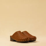 The Braided Clogs ATHENA by LABEL17 are expertly crafted from supple, vegetable-tanned leather, meticulously hand-braided for a rich, textured finish. The intricate craftsmanship showcases the beauty of traditional techniques, while a durable Vibram sole provides lasting comfort and stability with every step. Designed with an artisanal approach, these clogs make a refined yet effortless statement. Quiet luxury at its finest. Handmade in Greece.