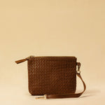 The Braided Leather Pouch GAIA by LABEL17 is crafted from soft, vegetable tanned nappa leather using an intricate braiding technique. Designed to carry your essentials, it features a leather strap with carabiner, allowing you to wear it on its own or attach it seamlessly inside your LABEL17 bags.