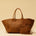 The Shoulder Bag Original XL (Weekender) by LABEL17 is made from supple, vegetable-tanned nappa leather. The hand-braided leather bag can be made smaller on both sides from the inside with press studs and also includes a detachable, hand-braided pouch for organization inside the bag.