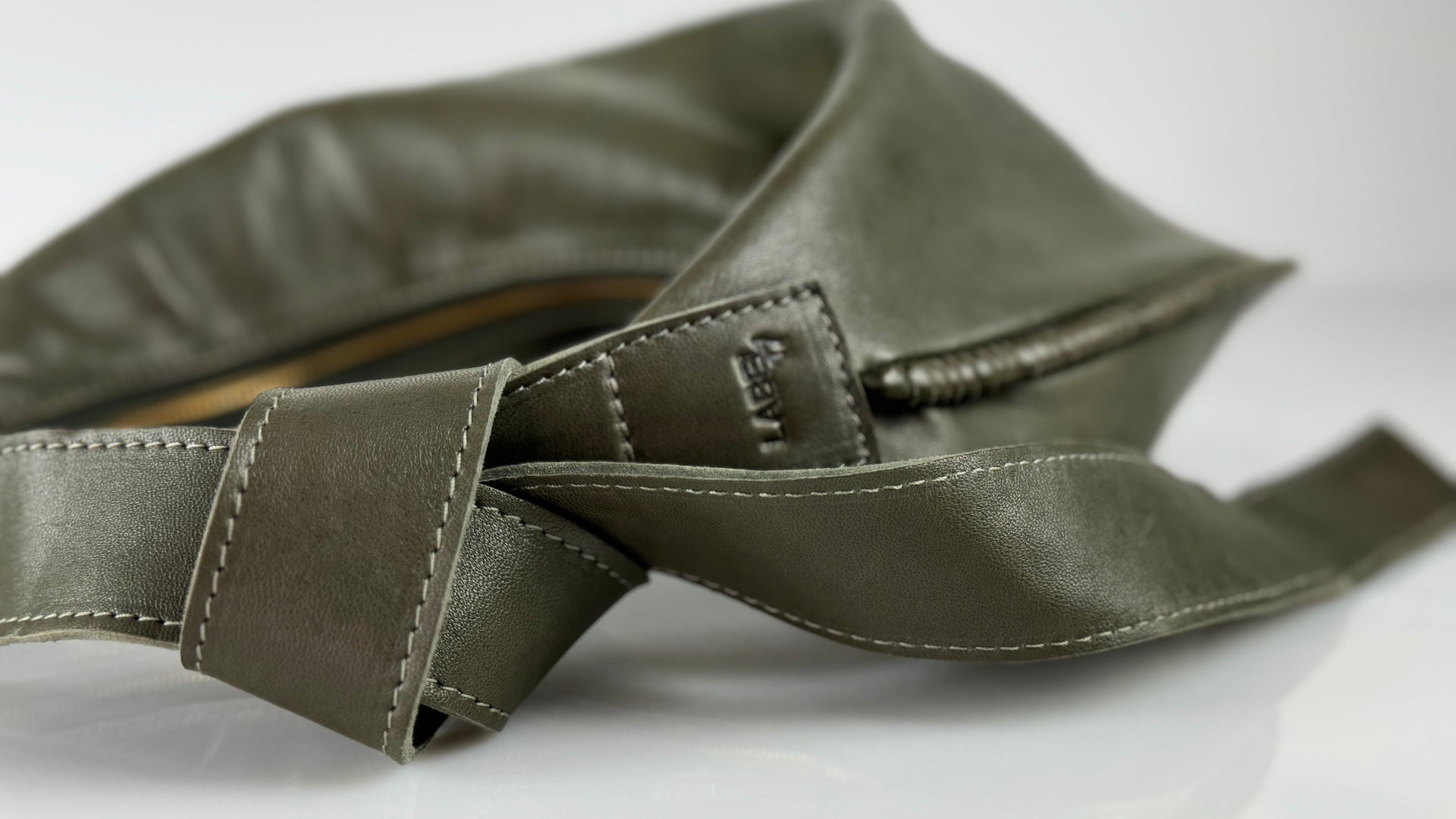 The Shoulder Bag Saddle Ivy in Olive by LABEL17 is crafted from the most supple Nappa leather